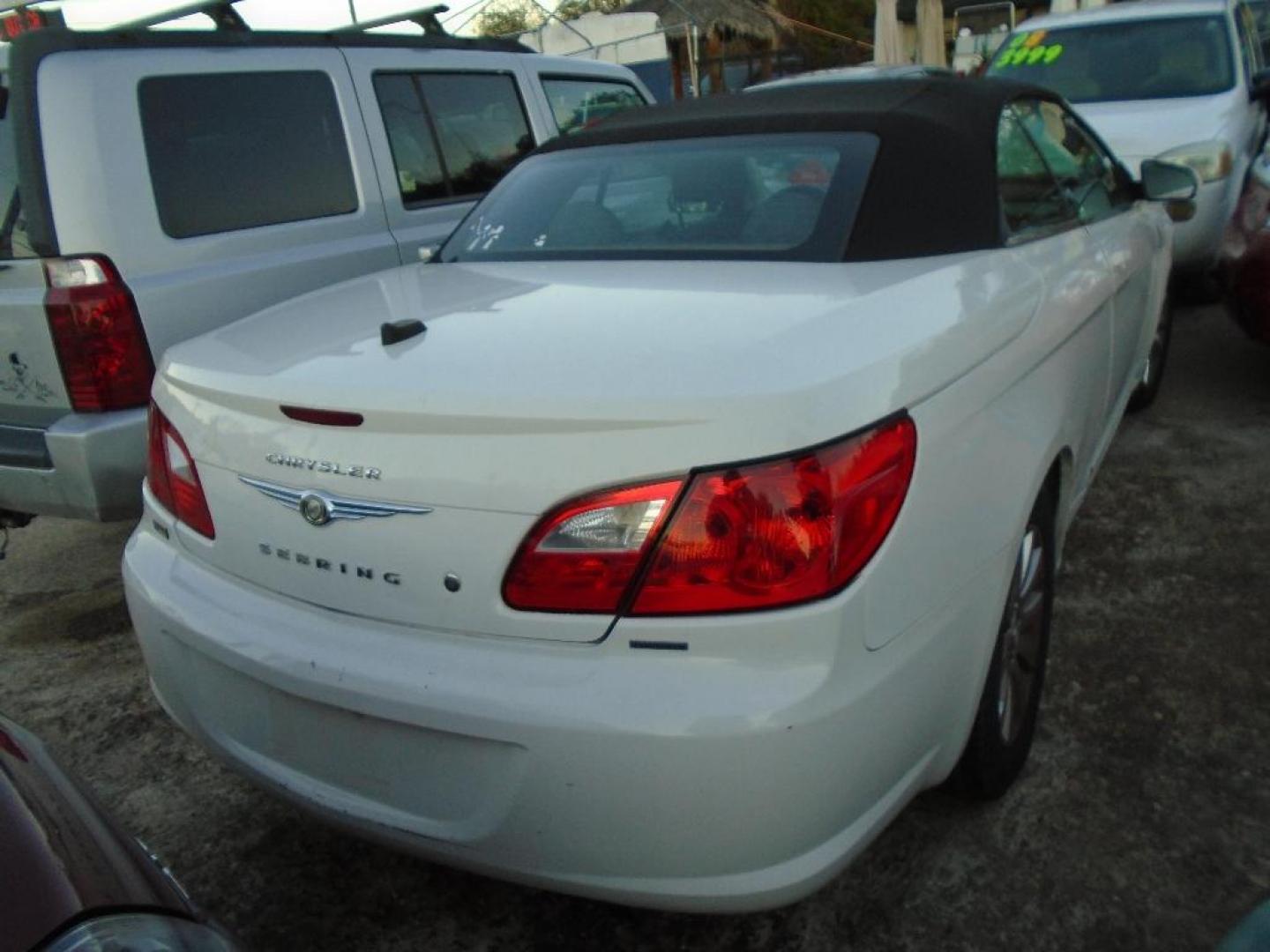 2010 WHITE CHRYSLER SEBRING Convertible Touring (1C3BC5ED1AN) with an 2.7L V6 DOHC 24V FFV engine, AUTOMATIC transmission, located at 2303 West Mt. Houston, Houston, 77038, (281) 507-3956, 29.771597, -95.339569 - Photo#2