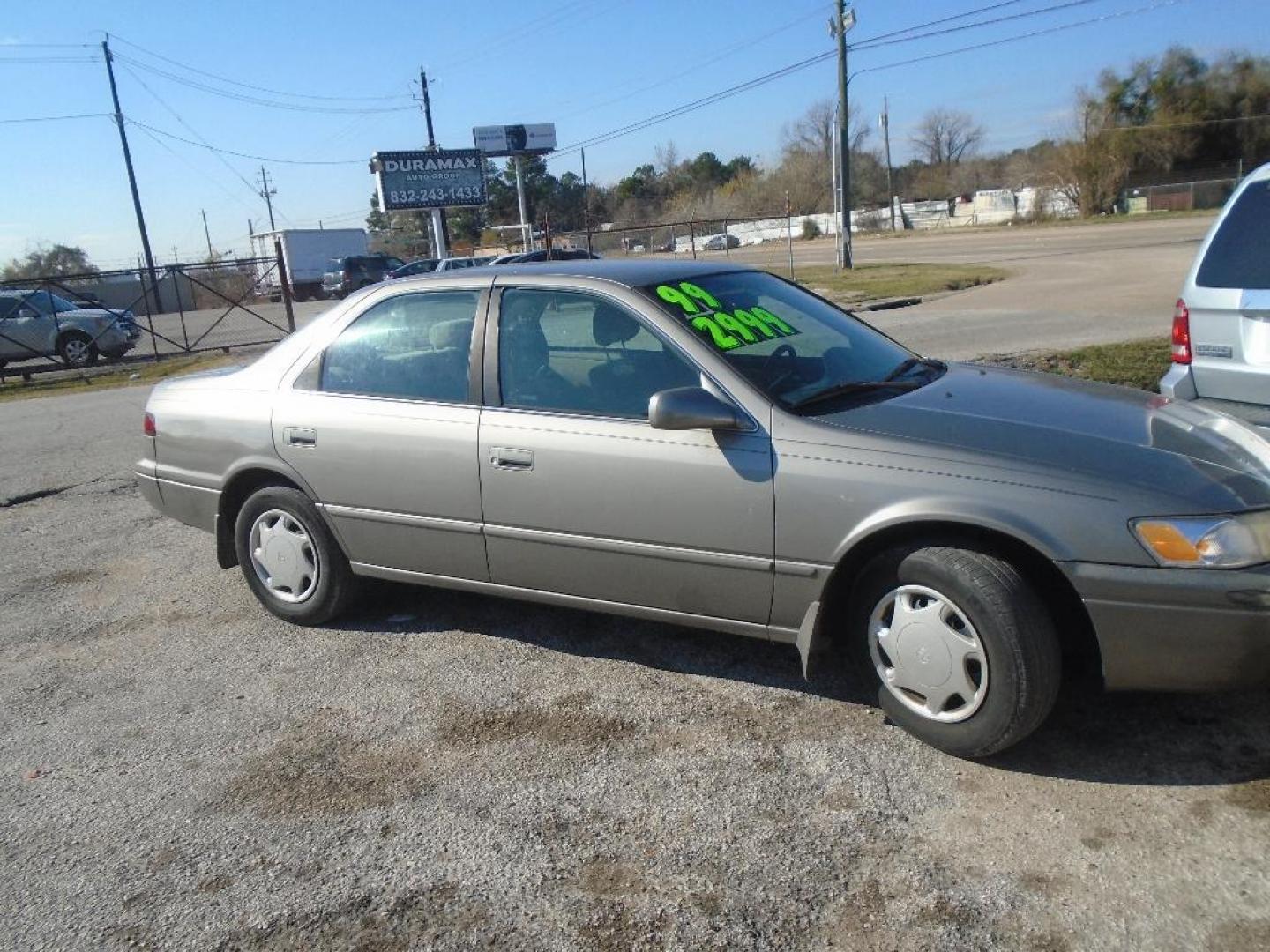 1999 TAN TOYOTA CAMRY CE (4T1BG22K8XU) with an 2.2L L4 DOHC 16V engine, AUTOMATIC transmission, located at 2303 West Mt. Houston, Houston, 77038, (281) 507-3956, 29.771597, -95.339569 - Photo#0