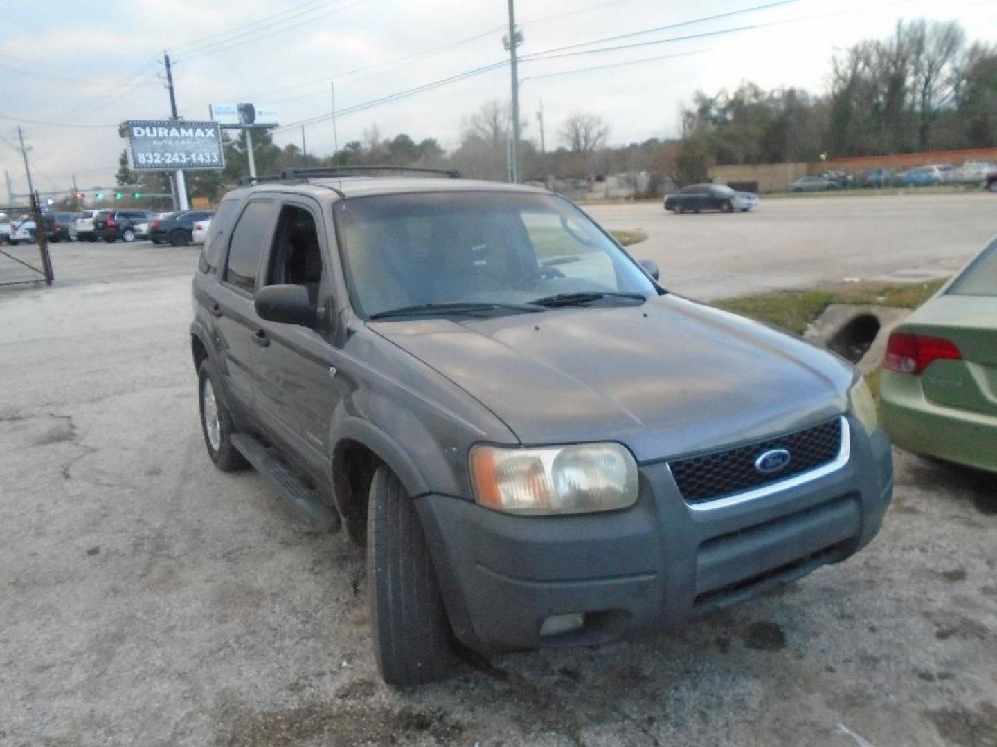 2002 GRAY FORD ESCAPE XLT Choice 2WD (1FMYU03162K) with an 3.0L V6 DOHC 24V engine, AUTOMATIC transmission, located at 2303 West Mt. Houston, Houston, Texas, 77038, (281) 507-3956, 29.771597, -95.339569 - Photo#0