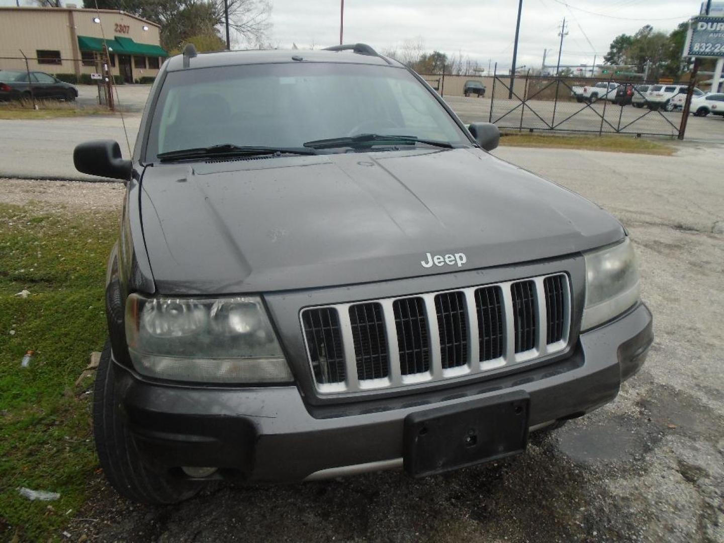 2004 GRAY JEEP GRAND CHEROKEE Laredo 4WD (1J4GW48S84C) with an 4.0L L6 OHV 12V engine, AUTOMATIC transmission, located at 2303 West Mt. Houston, Houston, 77038, (281) 507-3956, 29.771597, -95.339569 - Photo#0