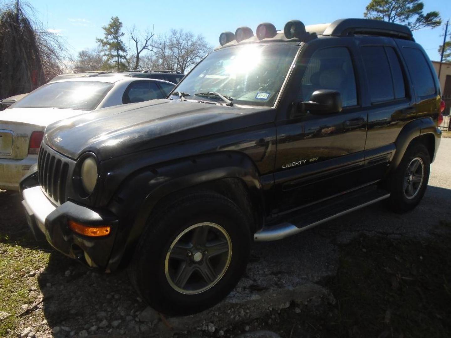 2003 BLACK JEEP LIBERTY Renegade 4WD (1J4GL38K63W) with an 3.7L V6 SOHC 12V engine, AUTOMATIC transmission, located at 2303 West Mt. Houston, Houston, 77038, (281) 507-3956, 29.771597, -95.339569 - Photo#0