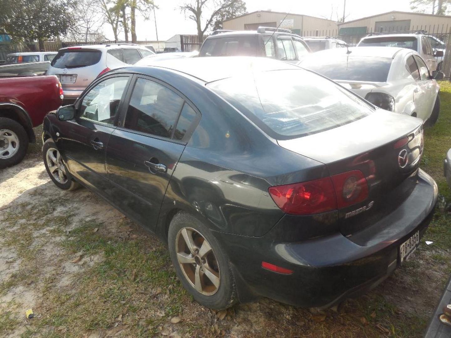 2004 BLACK MAZDA MAZDA3 i 4-door (JM1BK12F341) with an 2.0L L4 DOHC 16V engine, AUTOMATIC transmission, located at 2303 West Mt. Houston, Houston, 77038, (281) 507-3956, 29.771597, -95.339569 - Photo#2