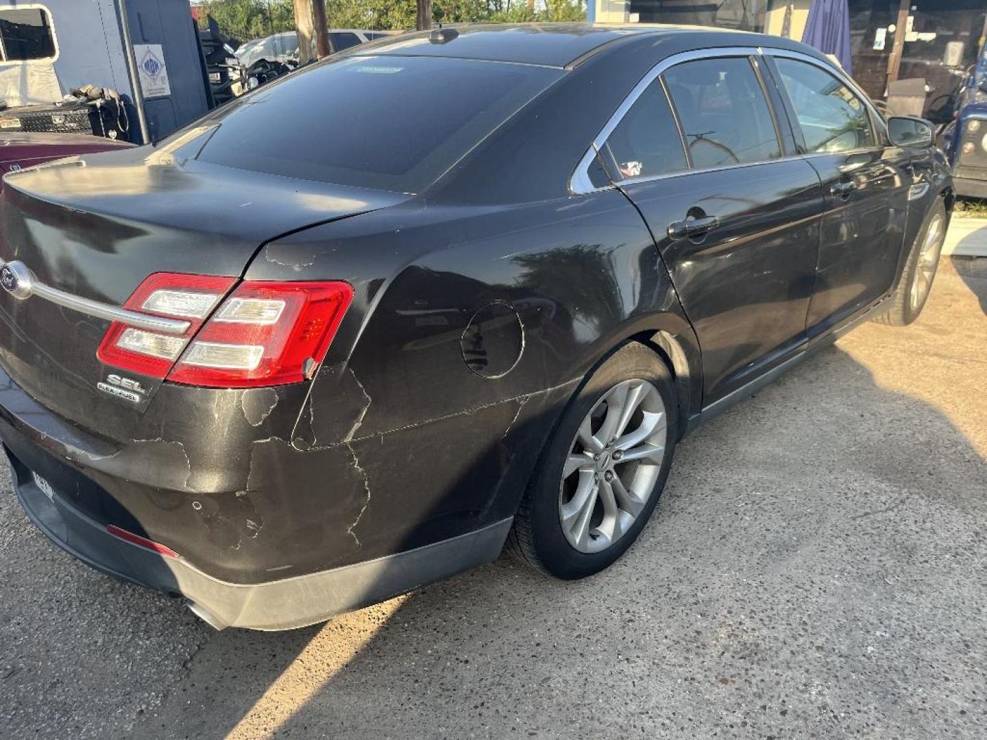 2013 BLACK FORD TAURUS SEL FWD (1FAHP2E85DG) with an 3.5L V6 DOHC 24V engine, AUTOMATIC transmission, located at 2303 West Mt. Houston, Houston, Texas, 77038, (281) 507-3956, 29.771597, -95.339569 - Photo#3