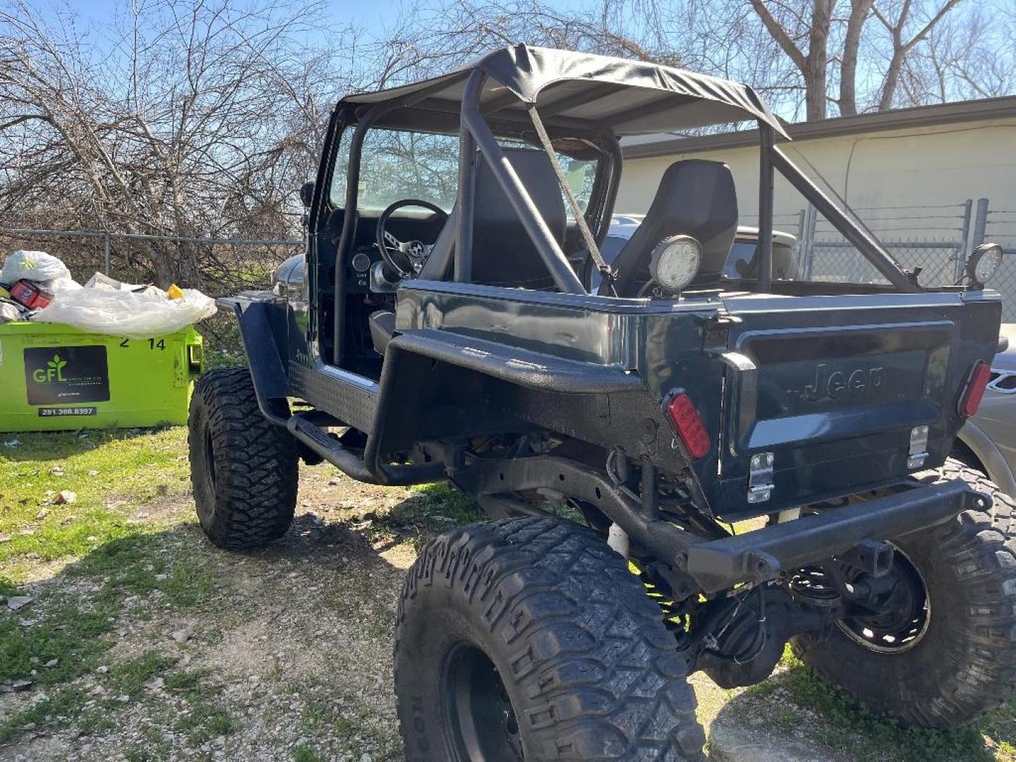 1985 BLACK JEEP CJ7 Laredo (1JCCF87E4FT) with an 4.2L L6 OHV engine, AUTOMATIC transmission, located at 2303 West Mt. Houston, Houston, Texas, 77038, (281) 507-3956, 29.771597, -95.339569 - Photo#2