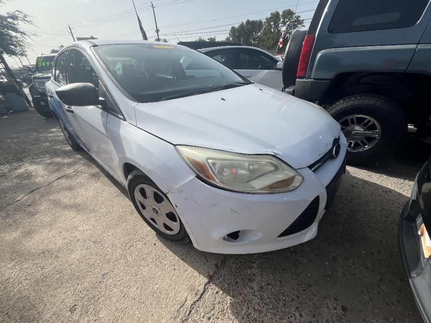 2013 WHITE FORD FOCUS S Sedan (1FADP3E27DL) with an 2.0L L4 DOHC 16V engine, AUTOMATIC transmission, located at 2303 West Mt. Houston, Houston, Texas, 77038, (281) 507-3956, 29.771597, -95.339569 - Photo#0