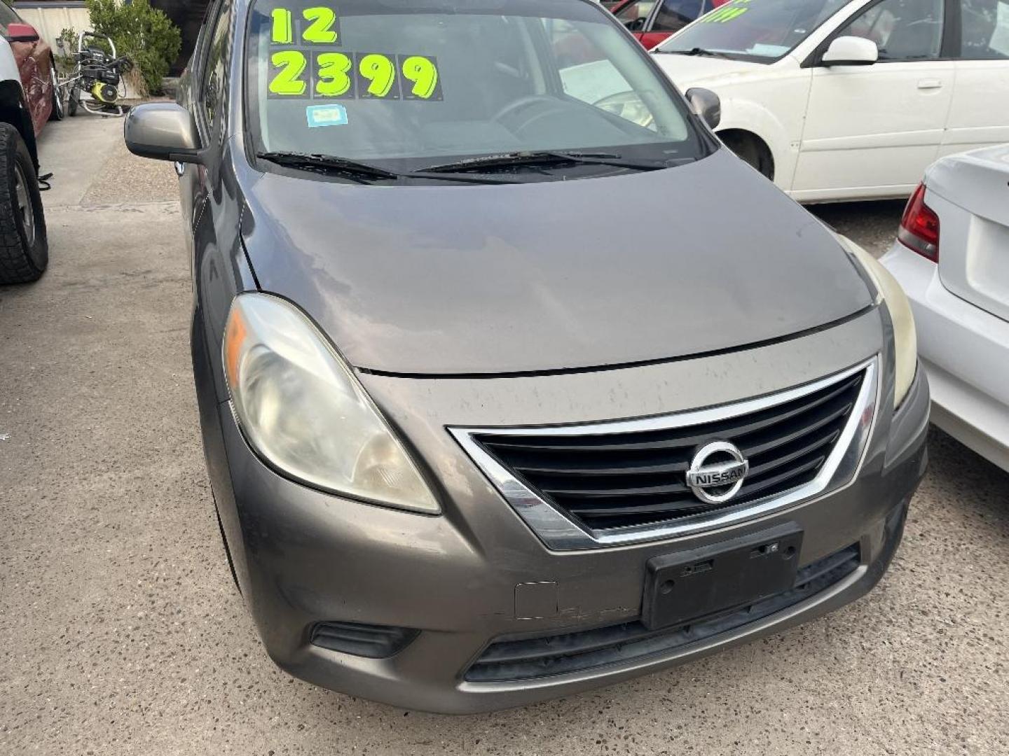 2012 BROWN NISSAN VERSA 1.6 S Sedan (3N1CN7AP4CL) with an 1.6L L4 DOHC 16V engine, AUTOMATIC transmission, located at 2303 West Mt. Houston, Houston, Texas, 77038, (281) 507-3956, 29.771597, -95.339569 - Photo#0