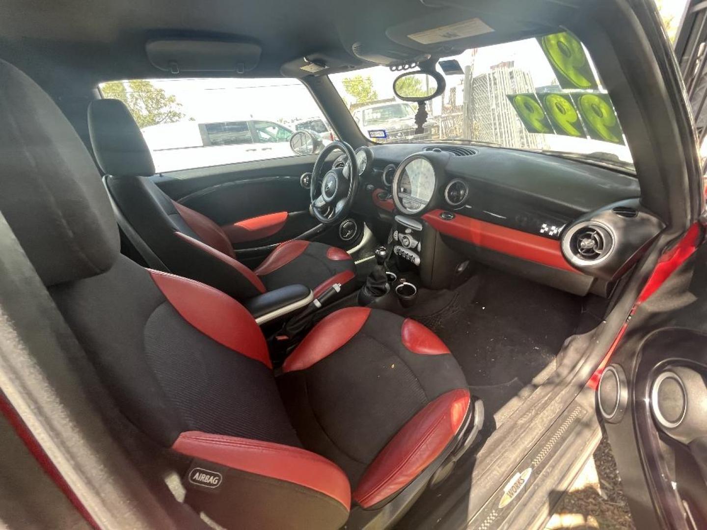 2009 RED MINI CLUBMAN John Cooper Works (WMWMM93579T) with an 1.6L L4 DOHC 16V TURBO engine, MANUAL transmission, located at 2303 West Mt. Houston, Houston, Texas, 77038, (281) 507-3956, 29.771597, -95.339569 - Photo#1