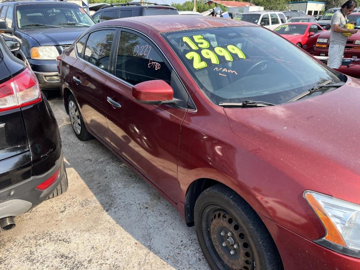 2015 RED NISSAN SENTRA S 6MT (3N1AB7AP0FY) with an 1.8L L4 SFI DOHC 16V engine, AUTOMATIC transmission, located at 2303 West Mt. Houston, Houston, Texas, 77038, (281) 507-3956, 29.771597, -95.339569 - Photo#1