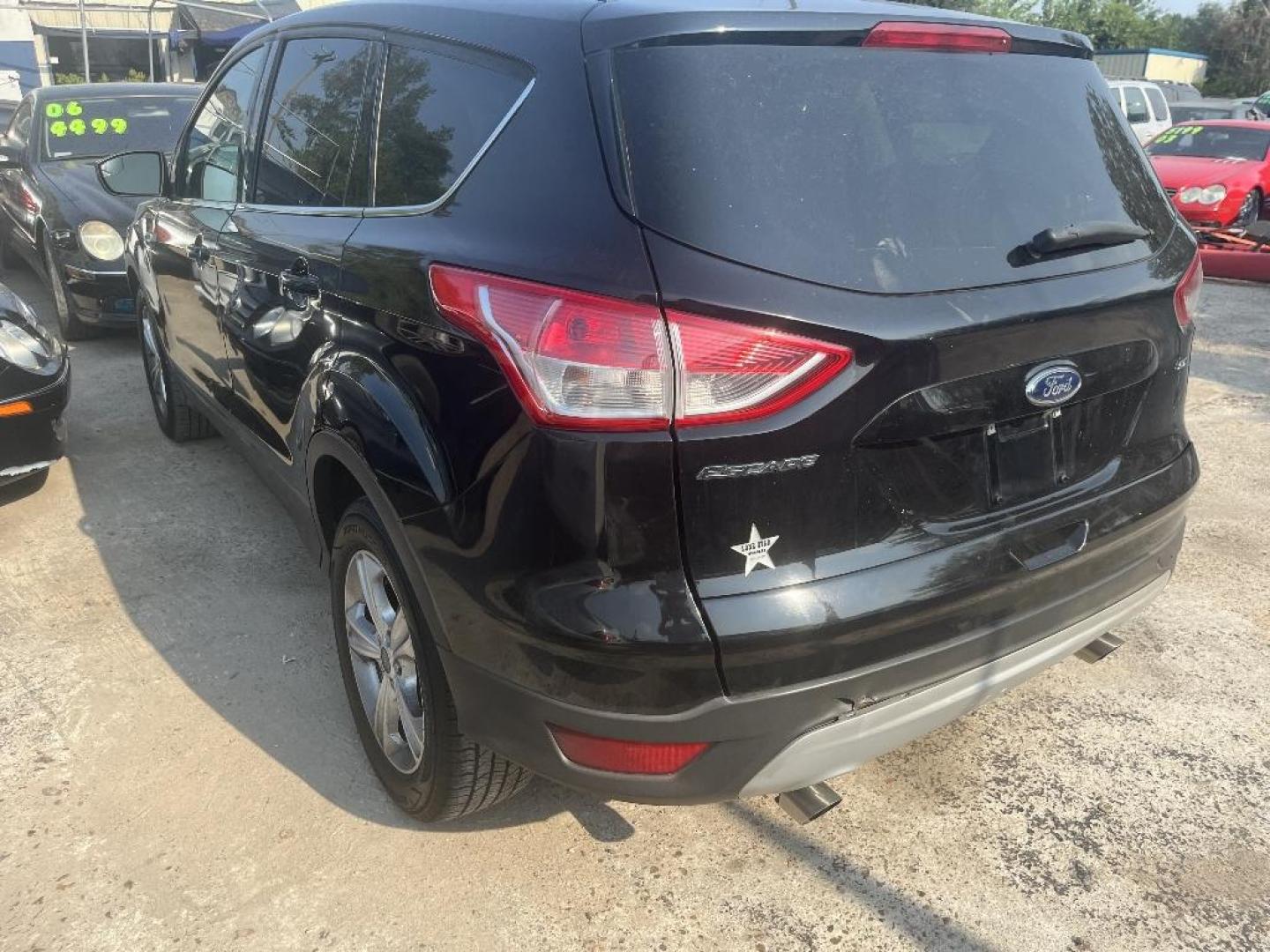 2016 BLACK FORD ESCAPE SE FWD (1FMCU0G75GU) with an 2.5L L4 DOHC 16V engine, AUTOMATIC transmission, located at 2303 West Mt. Houston, Houston, Texas, 77038, (281) 507-3956, 29.771597, -95.339569 - Photo#1