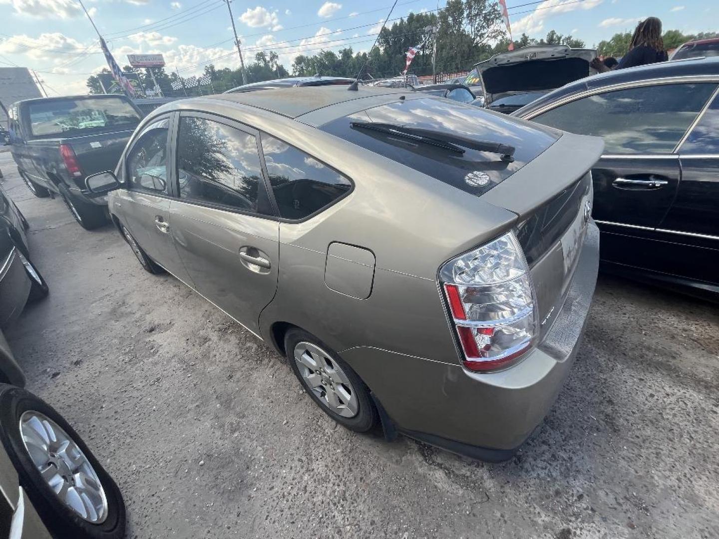 2006 GOLD TOYOTA PRIUS 4-Door Liftback (JTDKB20U663) with an 1.5L L4 DOHC 16V HYBRID engine, AUTOMATIC transmission, located at 2303 West Mt. Houston, Houston, Texas, 77038, (281) 507-3956, 29.771597, -95.339569 - Photo#2