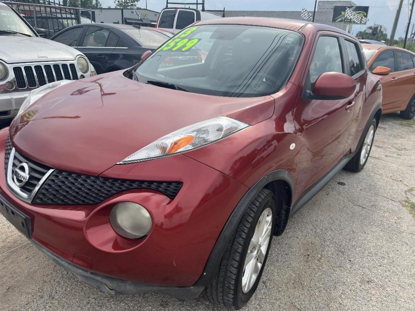 2013 RED NISSAN JUKE S FWD (JN8AF5MR3DT) with an 1.6L L4 DOHC 16V TURBO engine, AUTOMATIC transmission, located at 2303 West Mt. Houston, Houston, Texas, 77038, (281) 507-3956, 29.771597, -95.339569 - Photo#0