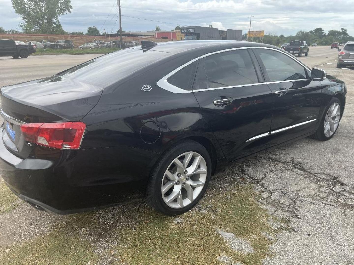 2015 BLACK CHEVROLET IMPALA 2LZ (2G1155SL2F9) with an 2.5L L4 DOHC 16V engine, AUTOMATIC transmission, located at 2303 West Mt. Houston, Houston, Texas, 77038, (281) 507-3956, 29.771597, -95.339569 - Photo#1