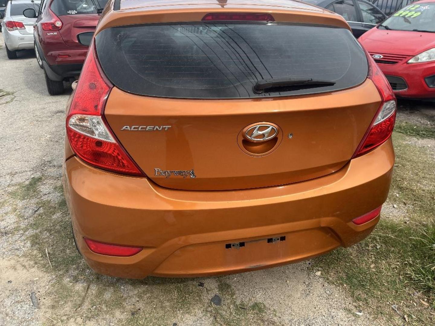 2015 ORANGE HYUNDAI ACCENT GS 5-Door 6A (KMHCT5AE1FU) with an 1.6L L4 DOHC 16V engine, AUTOMATIC transmission, located at 2303 West Mt. Houston, Houston, Texas, 77038, (281) 507-3956, 29.771597, -95.339569 - Photo#6