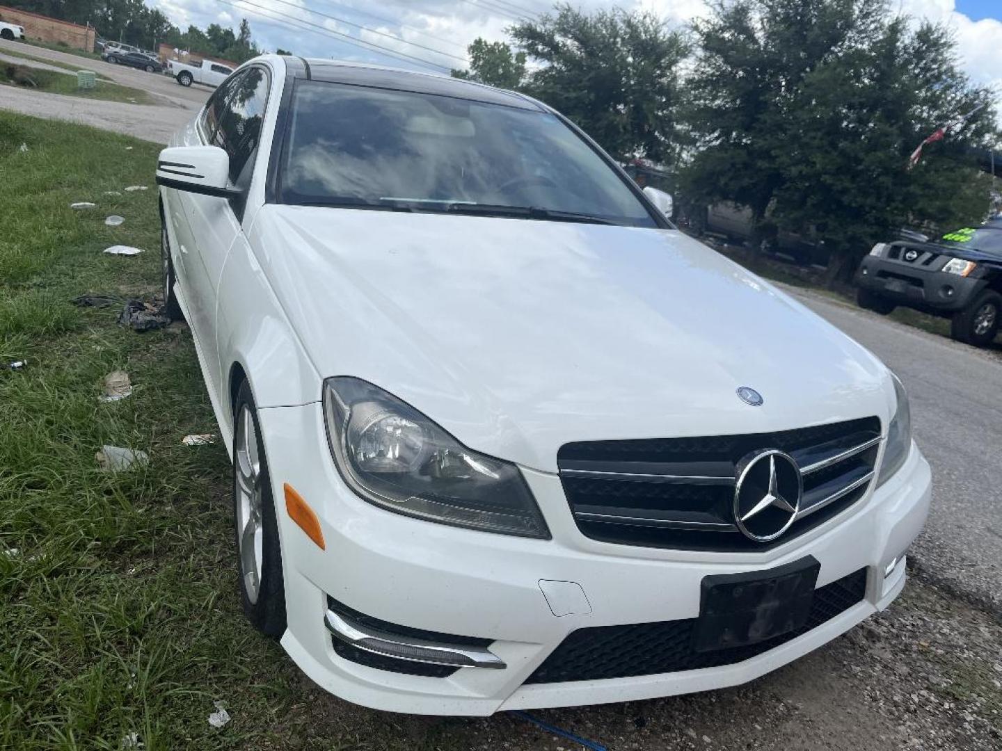 2015 WHITE MERCEDES-BENZ C-CLASS C250 Coupe (WDDGJ4HB7FG) with an 1.8L L4 DOHC 16V engine, AUTOMATIC transmission, located at 2303 West Mt. Houston, Houston, Texas, 77038, (281) 507-3956, 29.771597, -95.339569 - Photo#0