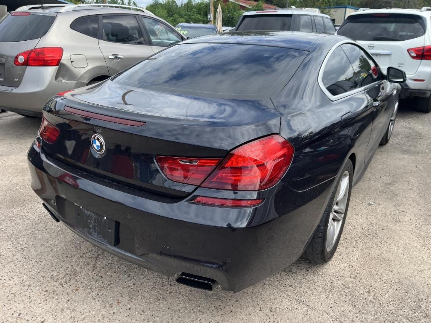 2012 BLACK BMW 6-SERIES 650i Coupe (WBALX5C50CC) with an 4.4L V8 DOHC 32V TURBO engine, AUTOMATIC transmission, located at 2303 West Mt. Houston, Houston, Texas, 77038, (281) 507-3956, 29.771597, -95.339569 - Photo#2