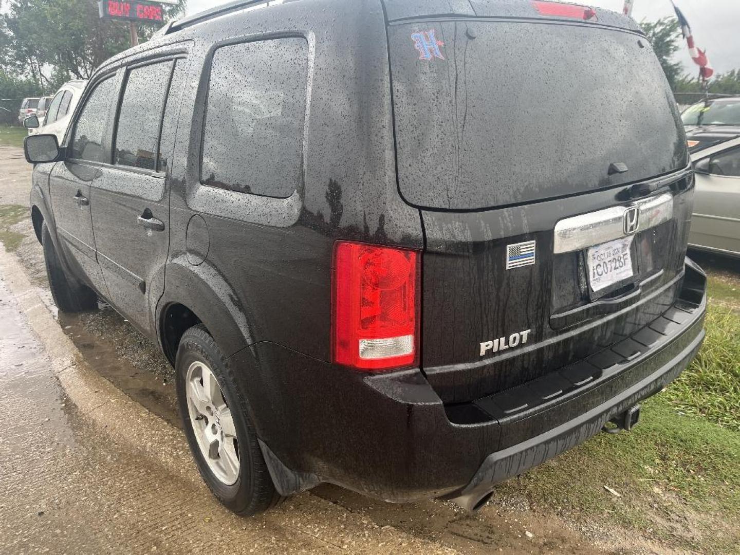 2011 BLACK HONDA PILOT EX-L 2WD 5-Spd AT (5FNYF3H56BB) with an 3.5L V6 SOHC 24V engine, AUTOMATIC transmission, located at 2303 West Mt. Houston, Houston, Texas, 77038, (281) 507-3956, 29.771597, -95.339569 - Photo#1