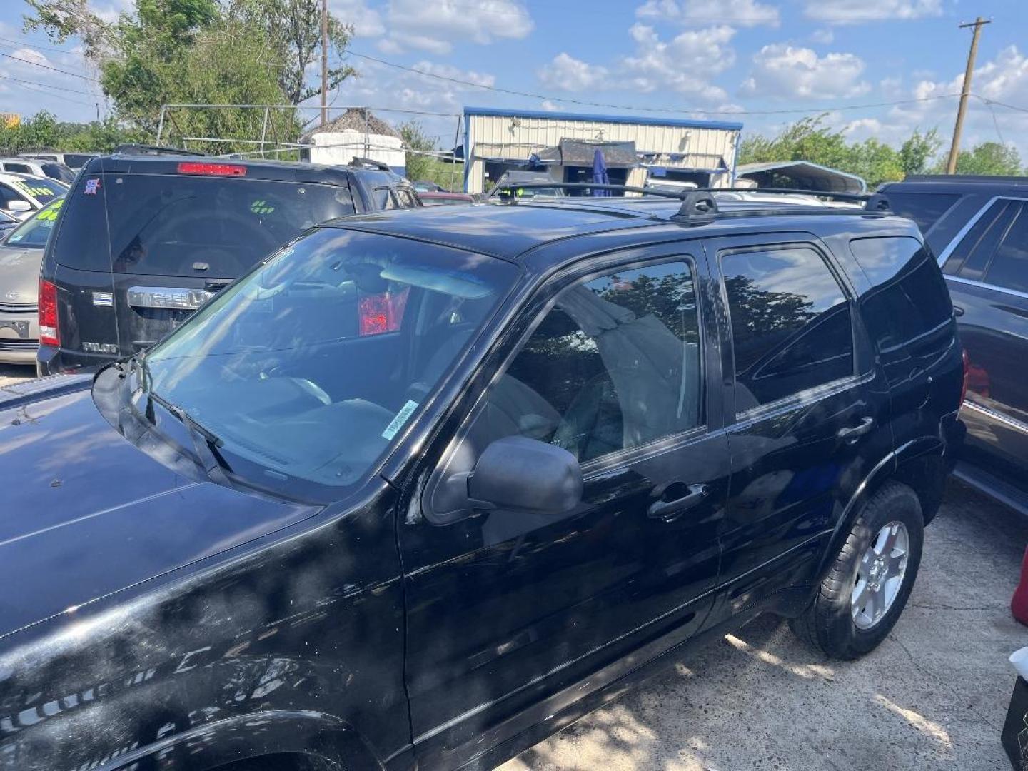 2006 BLACK FORD ESCAPE Limited 2WD (1FMYU04146K) with an 3.0L V6 DOHC 24V engine, AUTOMATIC transmission, located at 2303 West Mt. Houston, Houston, Texas, 77038, (281) 507-3956, 29.771597, -95.339569 - Photo#0