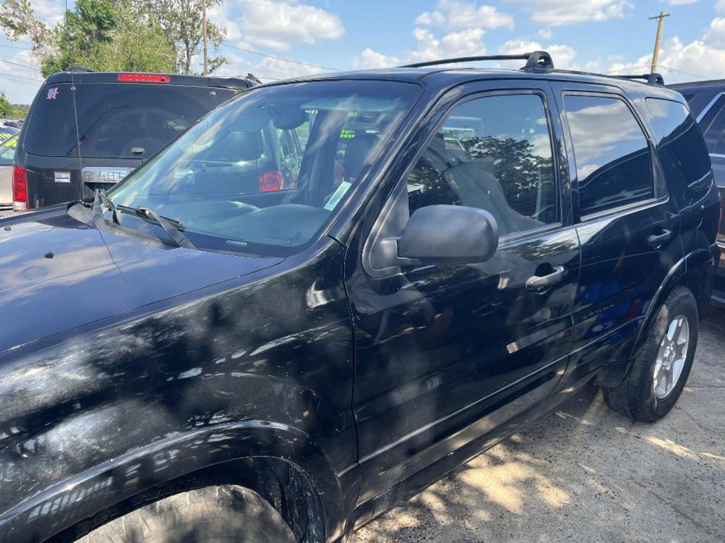 2006 BLACK FORD ESCAPE Limited 2WD (1FMYU04146K) with an 3.0L V6 DOHC 24V engine, AUTOMATIC transmission, located at 2303 West Mt. Houston, Houston, Texas, 77038, (281) 507-3956, 29.771597, -95.339569 - Photo#2