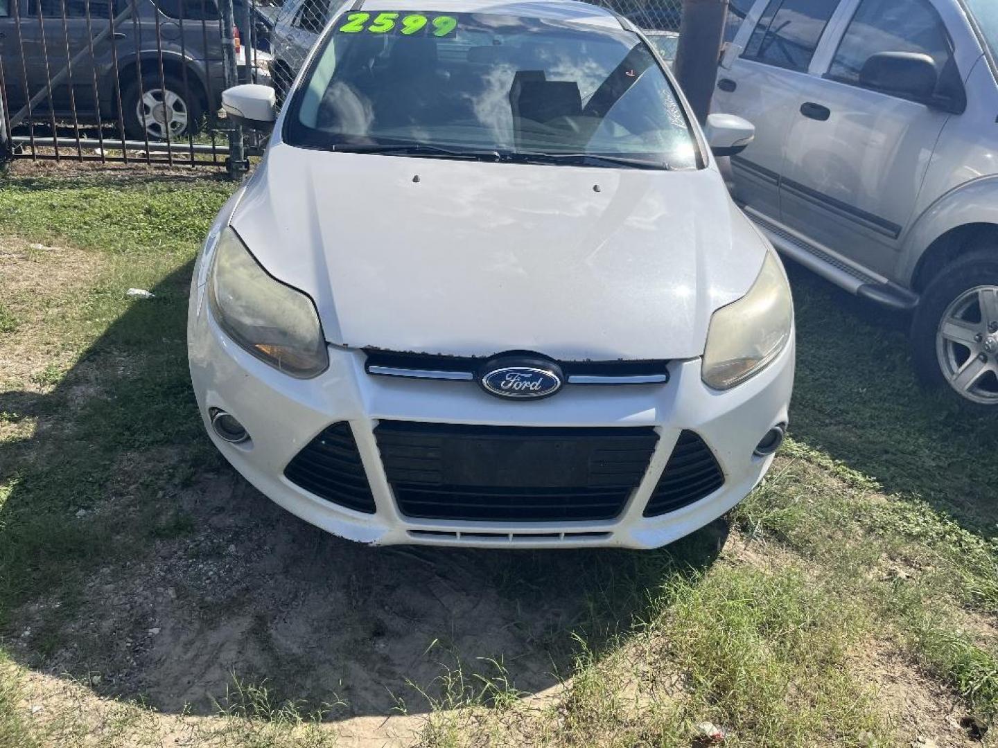 2014 WHITE FORD FOCUS Titanium Sedan (1FADP3J21EL) with an 2.0L L4 DOHC 16V engine, AUTOMATIC transmission, located at 2303 West Mt. Houston, Houston, Texas, 77038, (281) 507-3956, 29.771597, -95.339569 - Photo#0