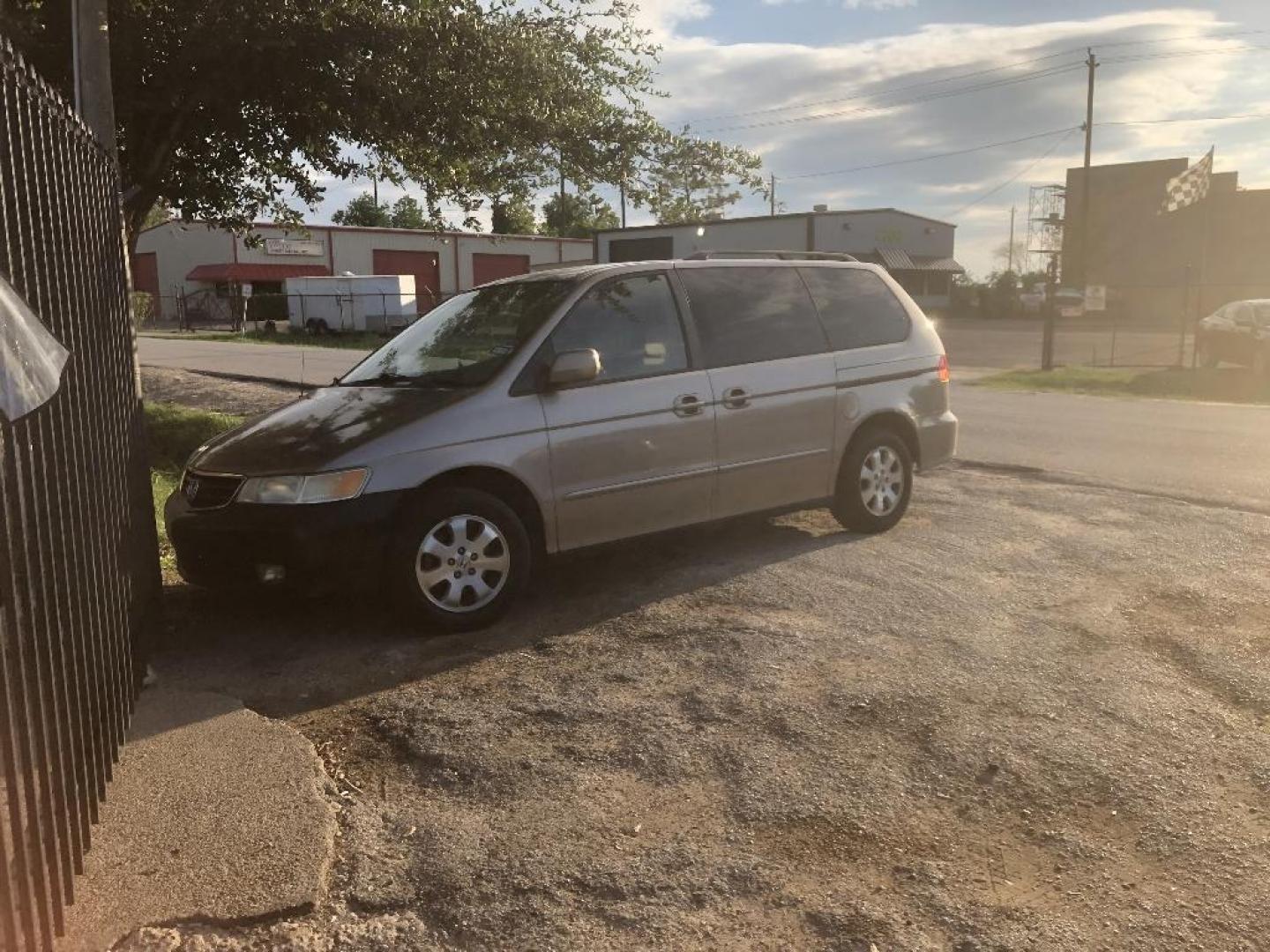 2004 BROWN HONDA ODYSSEY EX w/ Leather and DVD (5FNRL18094B) with an 3.5L V6 SOHC 24V engine, AUTOMATIC transmission, located at 2303 West Mt. Houston, Houston, Texas, 77038, (281) 507-3956, 29.771597, -95.339569 - Photo#1