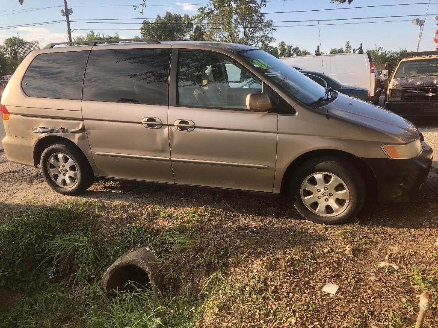 2004 BROWN HONDA ODYSSEY EX w/ Leather and DVD (5FNRL18094B) with an 3.5L V6 SOHC 24V engine, AUTOMATIC transmission, located at 2303 West Mt. Houston, Houston, Texas, 77038, (281) 507-3956, 29.771597, -95.339569 - Photo#3