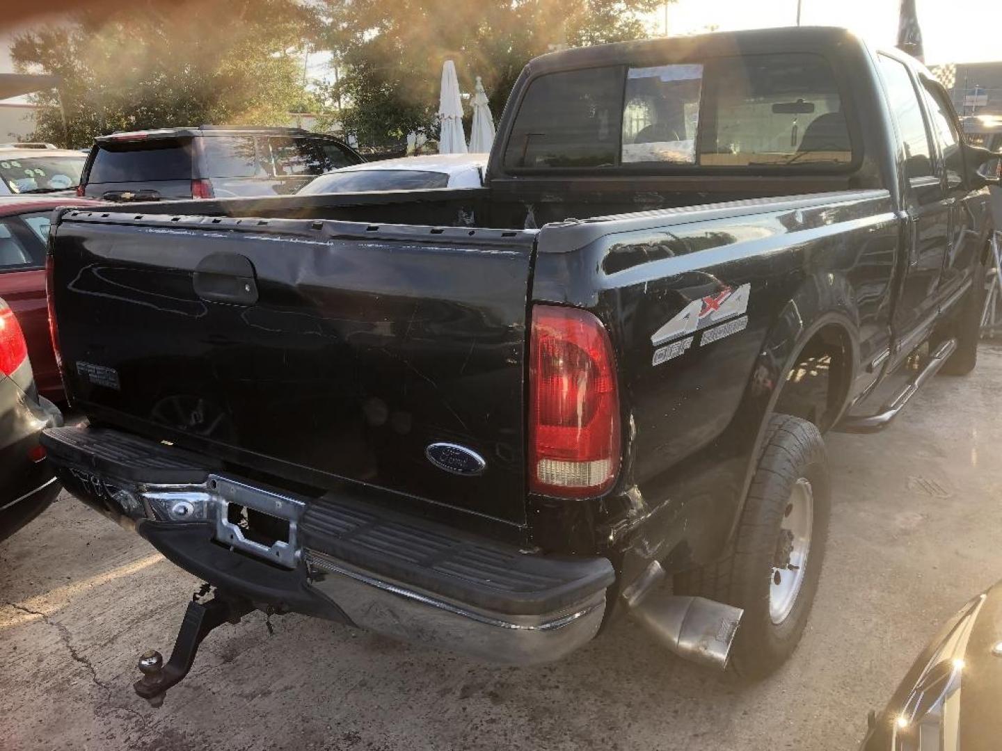 1999 BLACK FORD F-250 SD XLT Crew Cab SWB 4WD (1FTNW21S1XE) with an 6.8L V10 SOHC 20V engine, AUTOMATIC transmission, located at 2303 West Mt. Houston, Houston, Texas, 77038, (281) 507-3956, 29.771597, -95.339569 - Photo#2