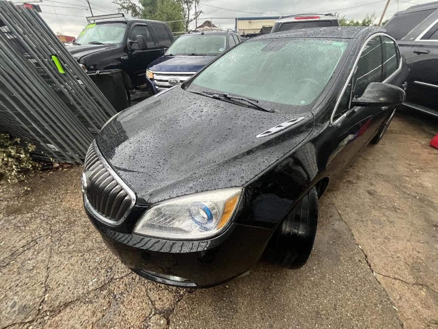 2013 BLACK BUICK VERANO Leather (1G4PS5SK3D4) with an 2.4L L4 DOHC 16V FFV engine, AUTOMATIC transmission, located at 2303 West Mt. Houston, Houston, Texas, 77038, (281) 507-3956, 29.771597, -95.339569 - Photo#1