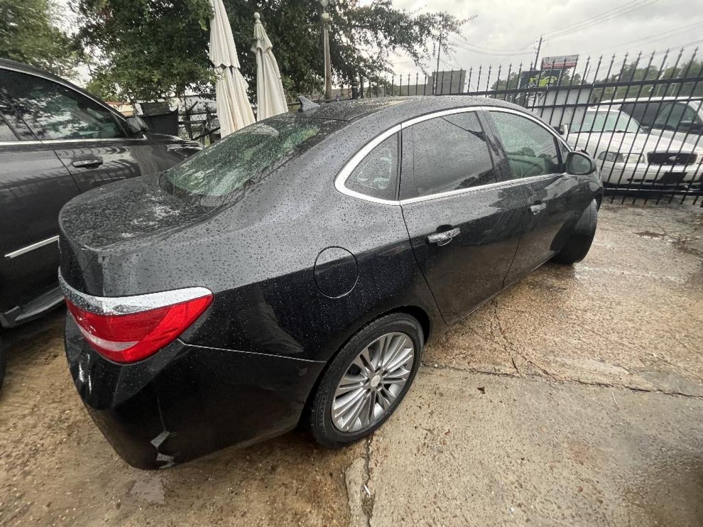 2013 BLACK BUICK VERANO Leather (1G4PS5SK3D4) with an 2.4L L4 DOHC 16V FFV engine, AUTOMATIC transmission, located at 2303 West Mt. Houston, Houston, Texas, 77038, (281) 507-3956, 29.771597, -95.339569 - Photo#2