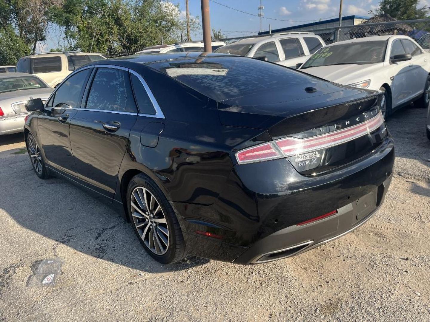 2017 BLACK LINCOLN MKZ Premier AWD (3LN6L5B97HR) with an 2.0L L4 DOHC 16V engine, AUTOMATIC transmission, located at 2303 West Mt. Houston, Houston, Texas, 77038, (281) 507-3956, 29.771597, -95.339569 - Photo#2