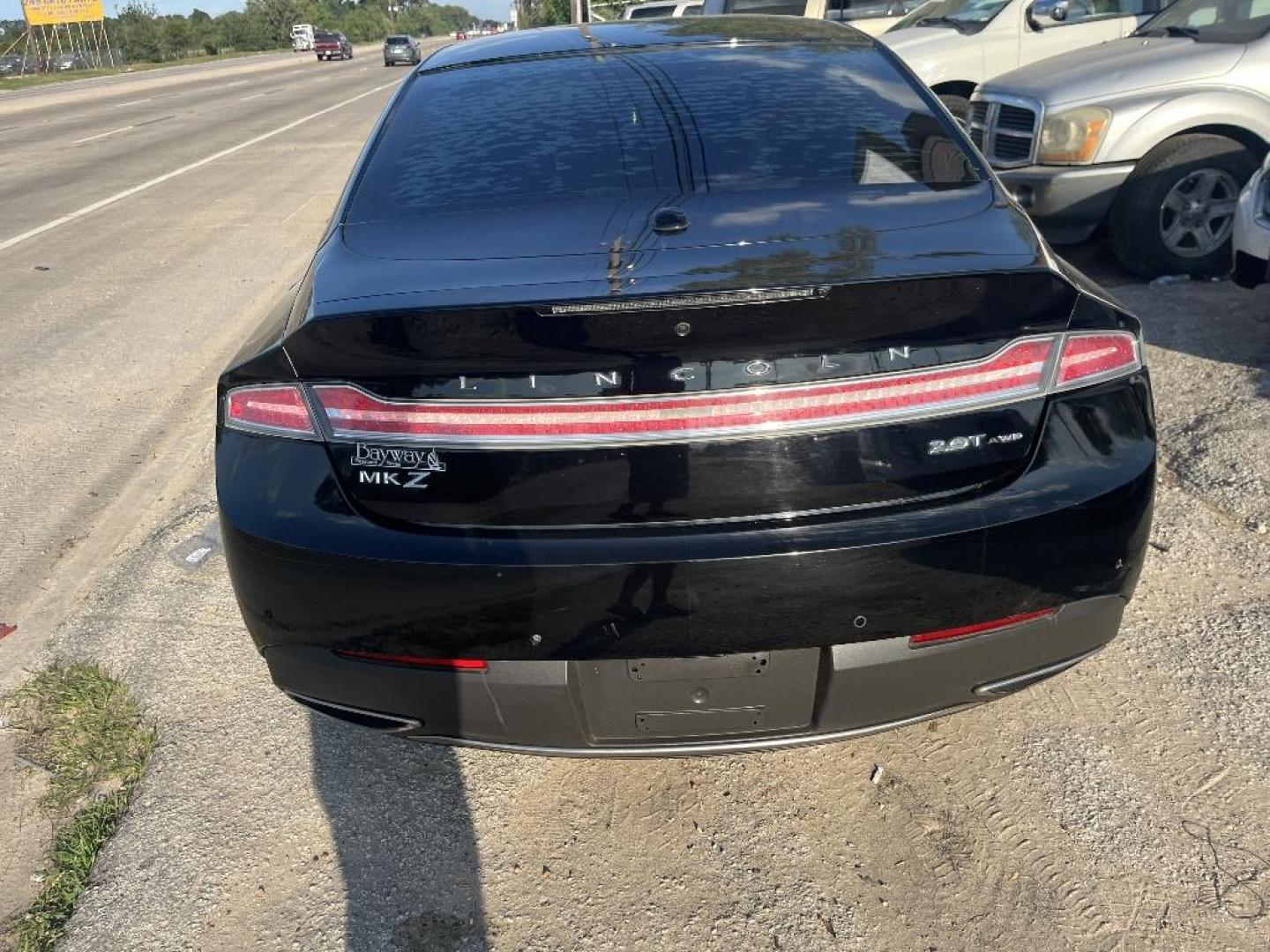 2017 BLACK LINCOLN MKZ Premier AWD (3LN6L5B97HR) with an 2.0L L4 DOHC 16V engine, AUTOMATIC transmission, located at 2303 West Mt. Houston, Houston, Texas, 77038, (281) 507-3956, 29.771597, -95.339569 - Photo#3