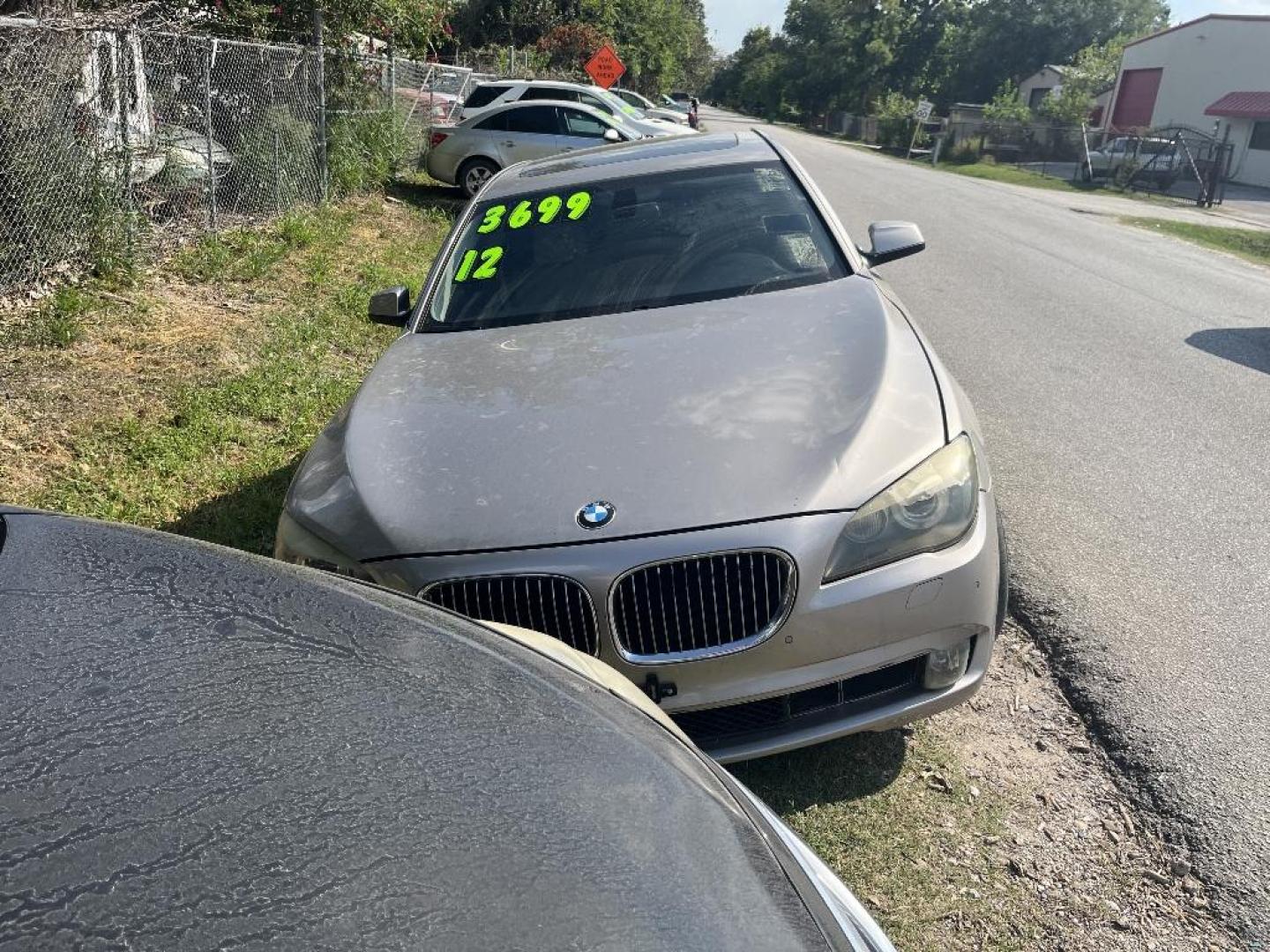 2012 BROWN BMW 7-SERIES 740iL (WBAKB4C58CC) with an 3.0L L6 DOHC 24V engine, AUTOMATIC transmission, located at 2303 West Mt. Houston, Houston, Texas, 77038, (281) 507-3956, 29.771597, -95.339569 - Photo#0