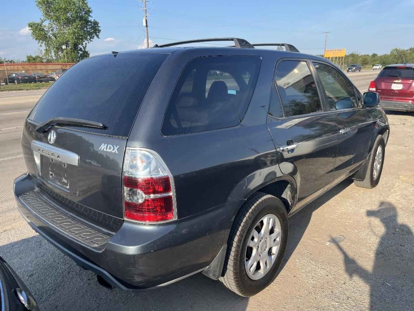 2004 BLACK ACURA MDX Touring (2HNYD186X4H) with an 3.5L V6 SOHC 24V engine, AUTOMATIC transmission, located at 2303 West Mt. Houston, Houston, Texas, 77038, (281) 507-3956, 29.771597, -95.339569 - Photo#2