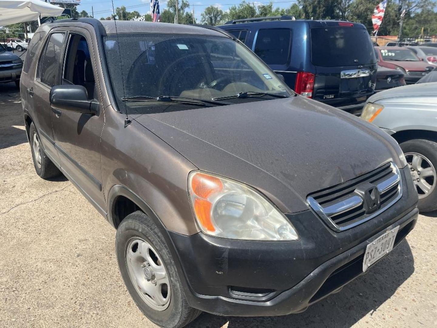 2002 BROWN HONDA CR-V LX 2WD (JHLRD68472C) with an 2.4L L4 DOHC 16V engine, AUTOMATIC transmission, located at 2303 West Mt. Houston, Houston, Texas, 77038, (281) 507-3956, 29.771597, -95.339569 - Photo#0