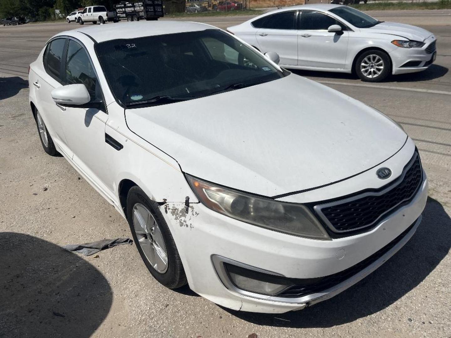 2012 WHITE KIA OPTIMA HYBRID Sedan (KNAGM4AD7C5) with an 2.4L L4 DOHC 16V HYBRID engine, AUTOMATIC transmission, located at 2303 West Mt. Houston, Houston, Texas, 77038, (281) 507-3956, 29.771597, -95.339569 - Photo#0