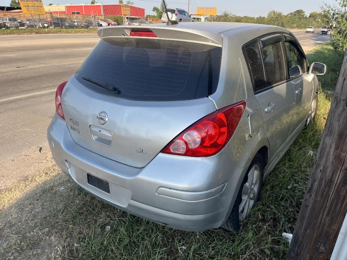 2012 SILVER NISSAN VERSA 1.8 SL Hatchback (3N1BC1CP1CK) with an 1.8L L4 DOHC 16V engine, AUTOMATIC transmission, located at 2303 West Mt. Houston, Houston, Texas, 77038, (281) 507-3956, 29.771597, -95.339569 - Photo#1