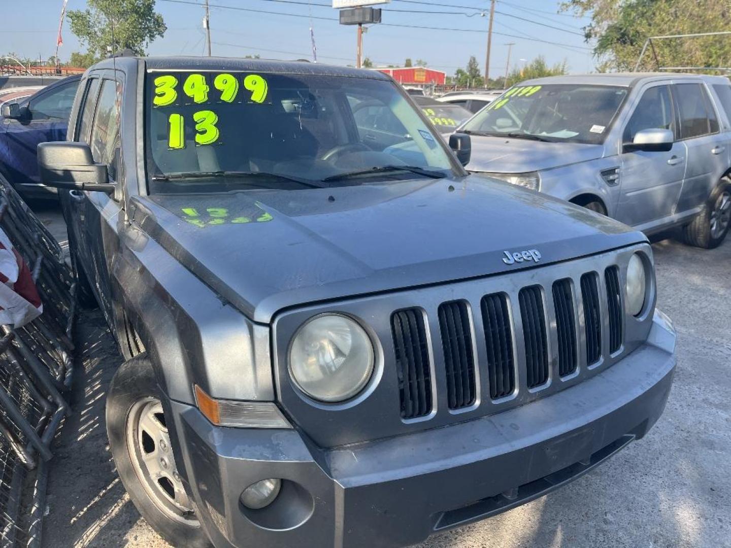 2013 GRAY JEEP PATRIOT Sport 2WD (1C4NJPBA8DD) with an 2.0L L4 DOHC 16V engine, AUTOMATIC transmission, located at 2303 West Mt. Houston, Houston, Texas, 77038, (281) 507-3956, 29.771597, -95.339569 - Photo#0