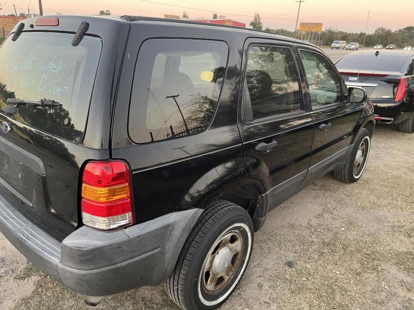 2004 BLACK FORD ESCAPE XLS 2WD (1FMYU02194K) with an 3.0L V6 DOHC 24V engine, AUTOMATIC transmission, located at 2303 West Mt. Houston, Houston, 77038, (281) 507-3956, 29.771597, -95.339569 - Photo#1