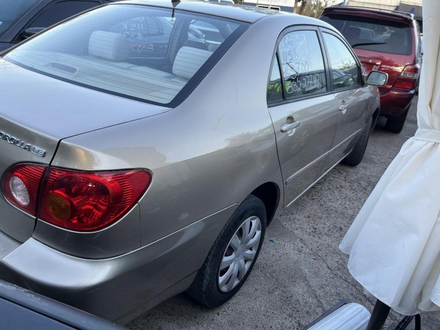 2004 BROWN TOYOTA COROLLA CE (1NXBR32E04Z) with an 1.8L L4 DOHC 16V engine, AUTOMATIC transmission, located at 2303 West Mt. Houston, Houston, 77038, (281) 507-3956, 29.771597, -95.339569 - Photo#4