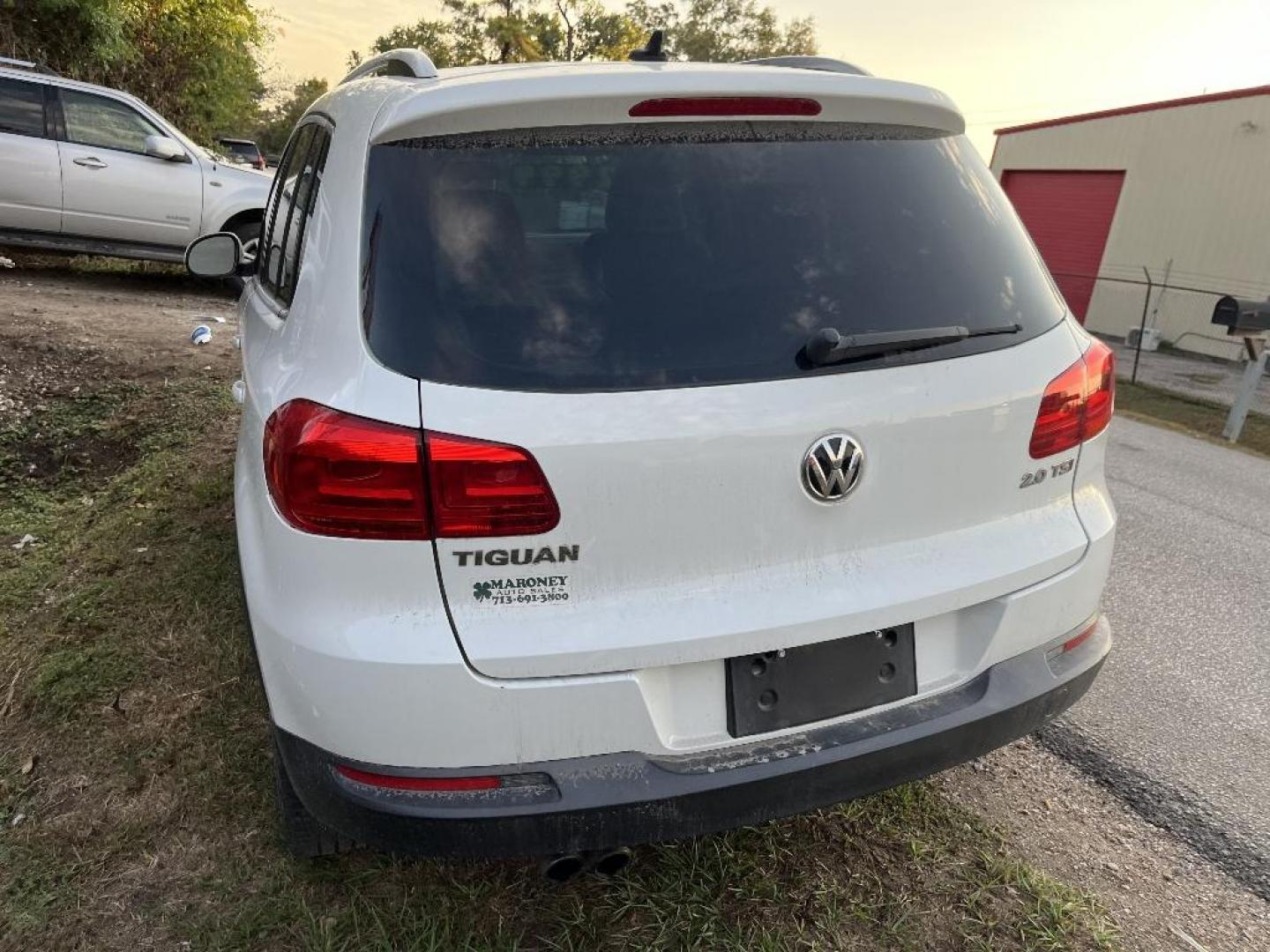 2014 WHITE VOLKSWAGEN TIGUAN S (WVGAV3AX4EW) with an 2.0L L4 DOHC 16V TURBO engine, AUTOMATIC transmission, located at 2303 West Mt. Houston, Houston, 77038, (281) 507-3956, 29.771597, -95.339569 - Photo#1