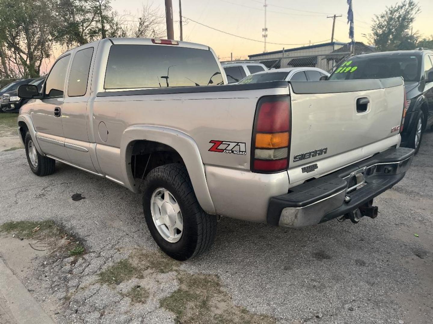 2004 BROWN GMC SIERRA 1500 Work Truck Ext. Cab Short Bed 4WD (2GTEK19T641) with an 5.3L V8 OHV 16V engine, AUTOMATIC transmission, located at 2303 West Mt. Houston, Houston, 77038, (281) 507-3956, 29.771597, -95.339569 - Photo#4