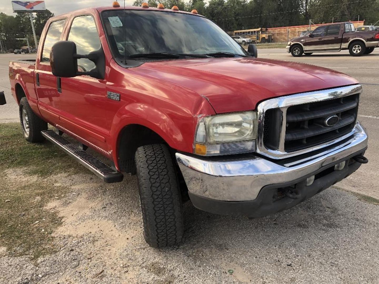 2004 RED FORD F-250 SD XLT Crew Cab 4WD (1FTNW21P34E) with an 6.0L V8 OHV 32V TURBO DIESEL engine, AUTOMATIC transmission, located at 2303 West Mt. Houston, Houston, 77038, (281) 507-3956, 29.771597, -95.339569 - Photo#0