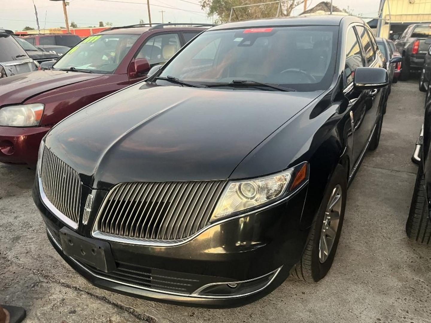 2015 BLACK LINCOLN MKT Livery AWD (2LMHJ5NK9FB) with an 3.7L V6 DOHC 24V engine, AUTOMATIC transmission, located at 2303 West Mt. Houston, Houston, 77038, (281) 507-3956, 29.771597, -95.339569 - Photo#0