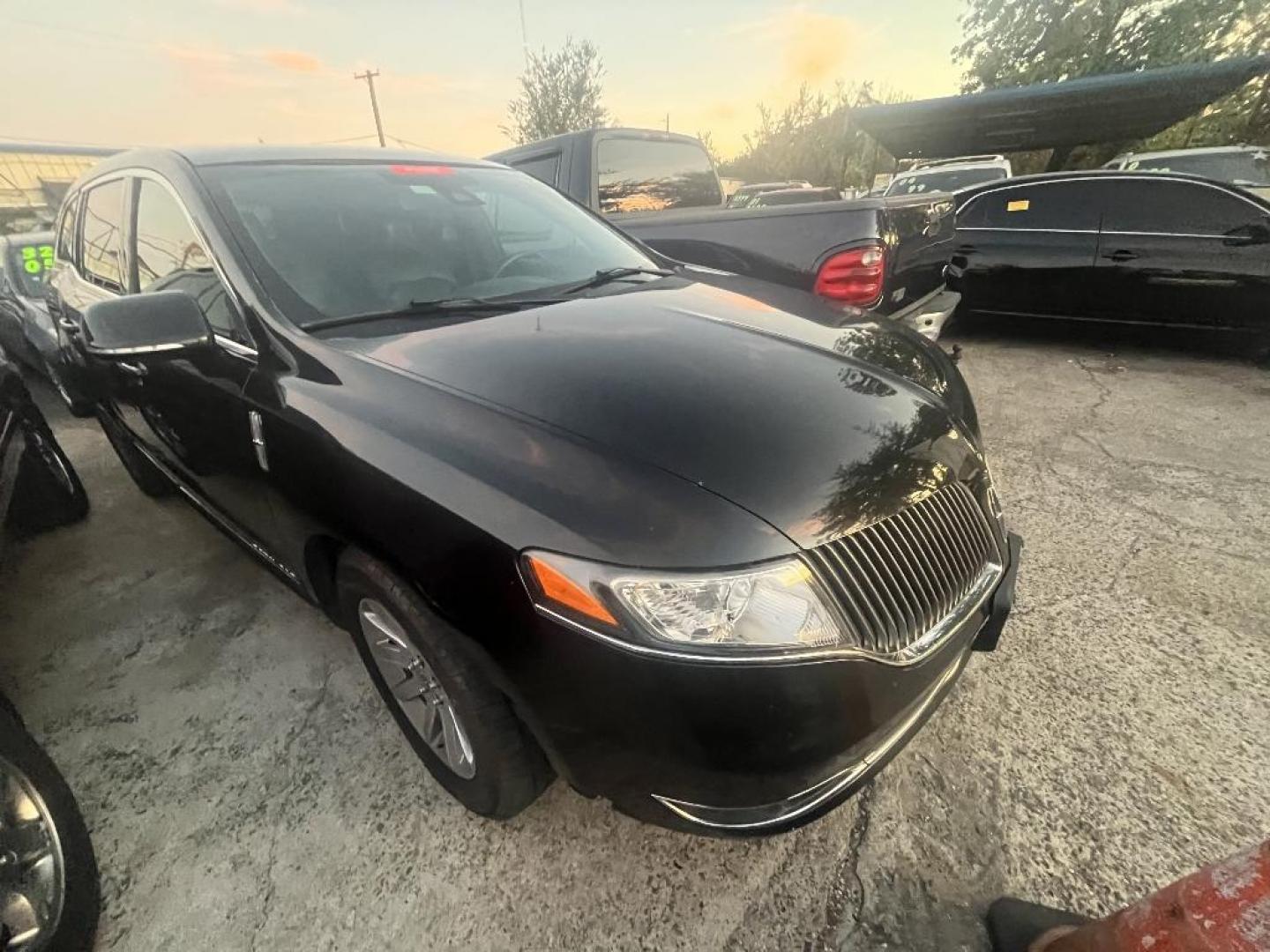 2015 BLACK LINCOLN MKT Livery AWD (2LMHJ5NK9FB) with an 3.7L V6 DOHC 24V engine, AUTOMATIC transmission, located at 2303 West Mt. Houston, Houston, 77038, (281) 507-3956, 29.771597, -95.339569 - Photo#1