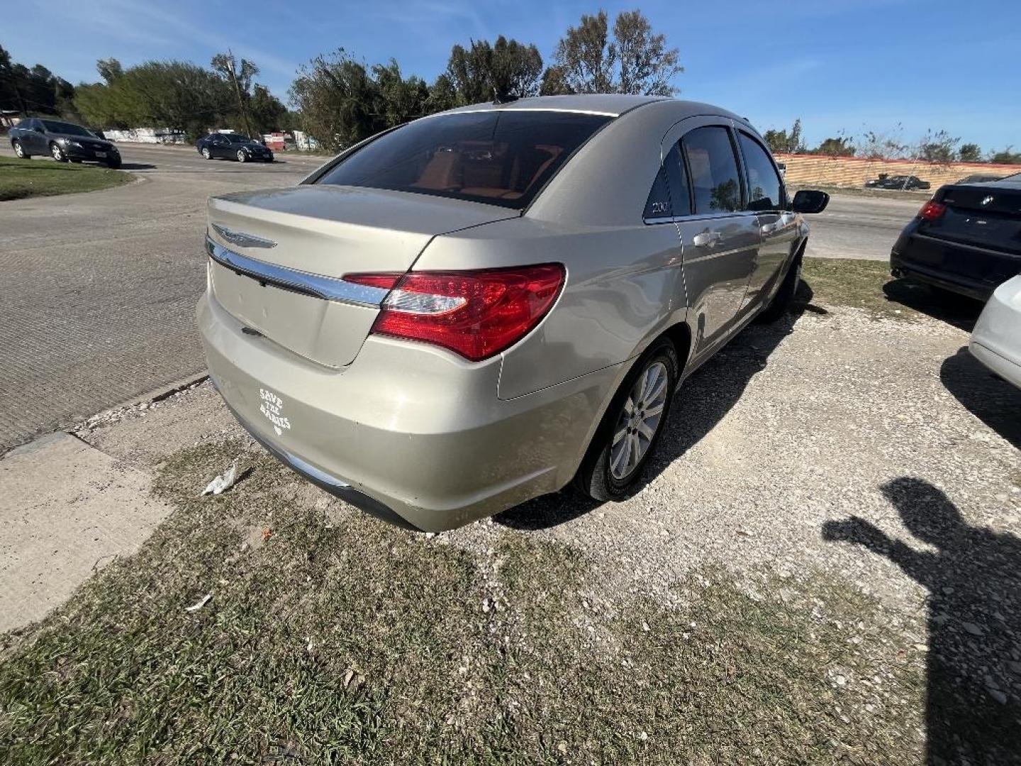 2014 GOLD CHRYSLER 200 Touring (1C3CCBBG2EN) with an 3.6L V6 DOHC 24V FFV engine, AUTOMATIC transmission, located at 2303 West Mt. Houston, Houston, 77038, (281) 507-3956, 29.771597, -95.339569 - Photo#2