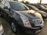 2015 BLUE CADILLAC SRX Luxury Collection FWD (3GYFNBE33FS) with an 3.6L V6 DOHC 24V FFV engine, AUTOMATIC transmission, located at 2303 West Mt. Houston, Houston, 77038, (281) 507-3956, 29.771597, -95.339569 - Photo#0