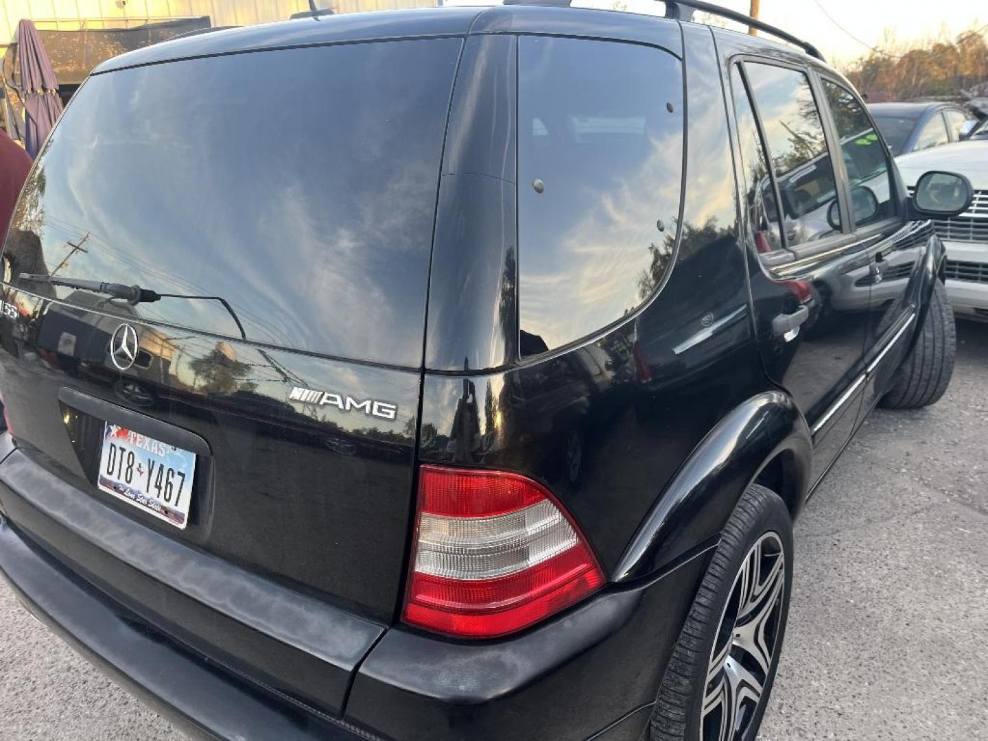 2000 BLACK MERCEDES-BENZ M-CLASS ML55 AMG (4JGAB74E7YA) with an 5.4L V8 SOHC 24V engine, AUTOMATIC transmission, located at 2303 West Mt. Houston, Houston, 77038, (281) 507-3956, 29.771597, -95.339569 - Photo#1