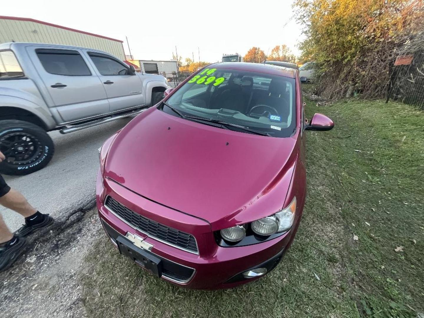 2014 RED CHEVROLET SONIC LT Auto Sedan (1G1JC5SH5E4) with an 1.8L L4 DOHC 24V engine, AUTOMATIC transmission, located at 2303 West Mt. Houston, Houston, 77038, (281) 507-3956, 29.771597, -95.339569 - Photo#1