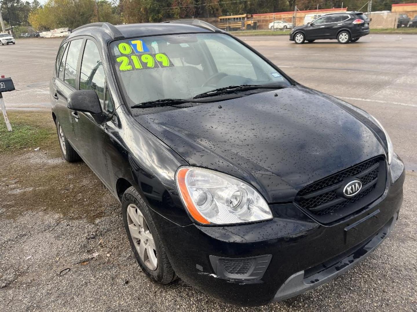 2007 BLACK KIA RONDO EX (KNAFG525577) with an 2.4L L4 DOHC 16V engine, AUTOMATIC transmission, located at 2303 West Mt. Houston, Houston, 77038, (281) 507-3956, 29.771597, -95.339569 - Photo#0