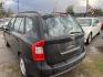 2007 BLACK KIA RONDO EX (KNAFG525577) with an 2.4L L4 DOHC 16V engine, AUTOMATIC transmission, located at 2303 West Mt. Houston, Houston, 77038, (281) 507-3956, 29.771597, -95.339569 - Photo#2