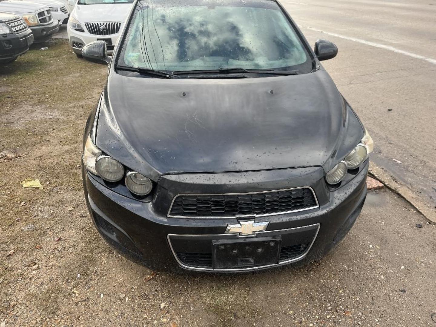 2015 BLACK CHEVROLET SONIC LT Auto Sedan (1G1JC5SH0F4) with an 1.8L L4 DOHC 24V engine, AUTOMATIC transmission, located at 2303 West Mt. Houston, Houston, 77038, (281) 507-3956, 29.771597, -95.339569 - Photo#0